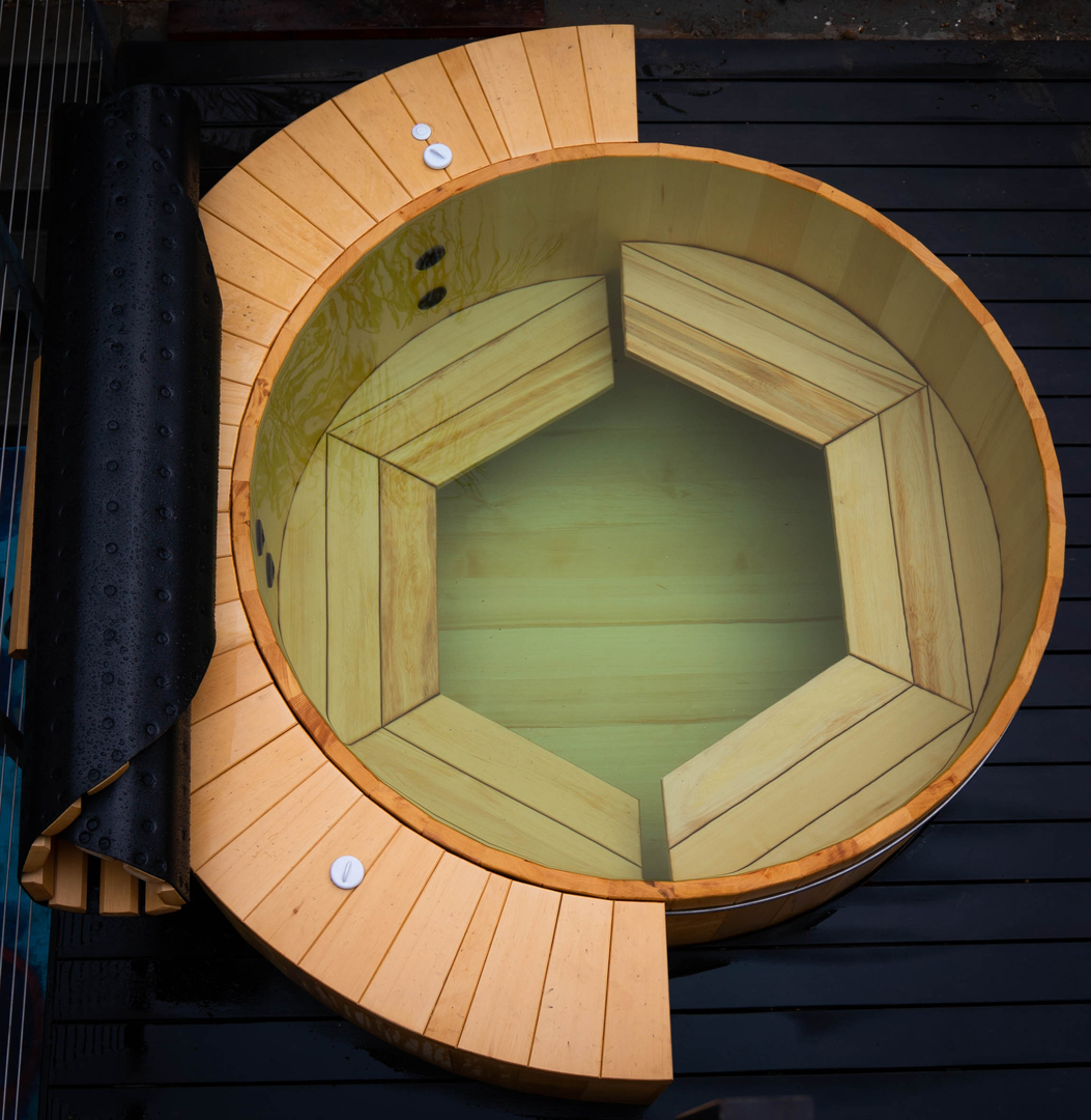 Alaskan yellow cedar hot tub with half a rim deck, cladding, split level bench, 6 jets, and a roll top cover